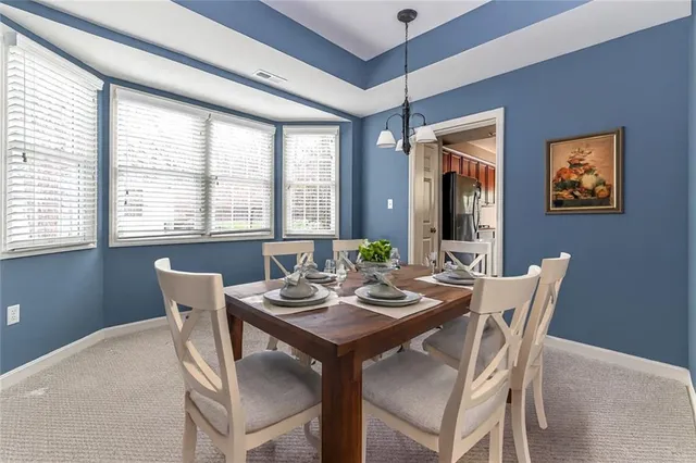 a living room with furniture fireplace and a flat screen tv