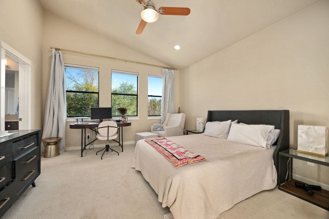 2819 Corbin Lane Austin, TX 78704 - Photo 12 of 22 a bedroom with a bed and a couch