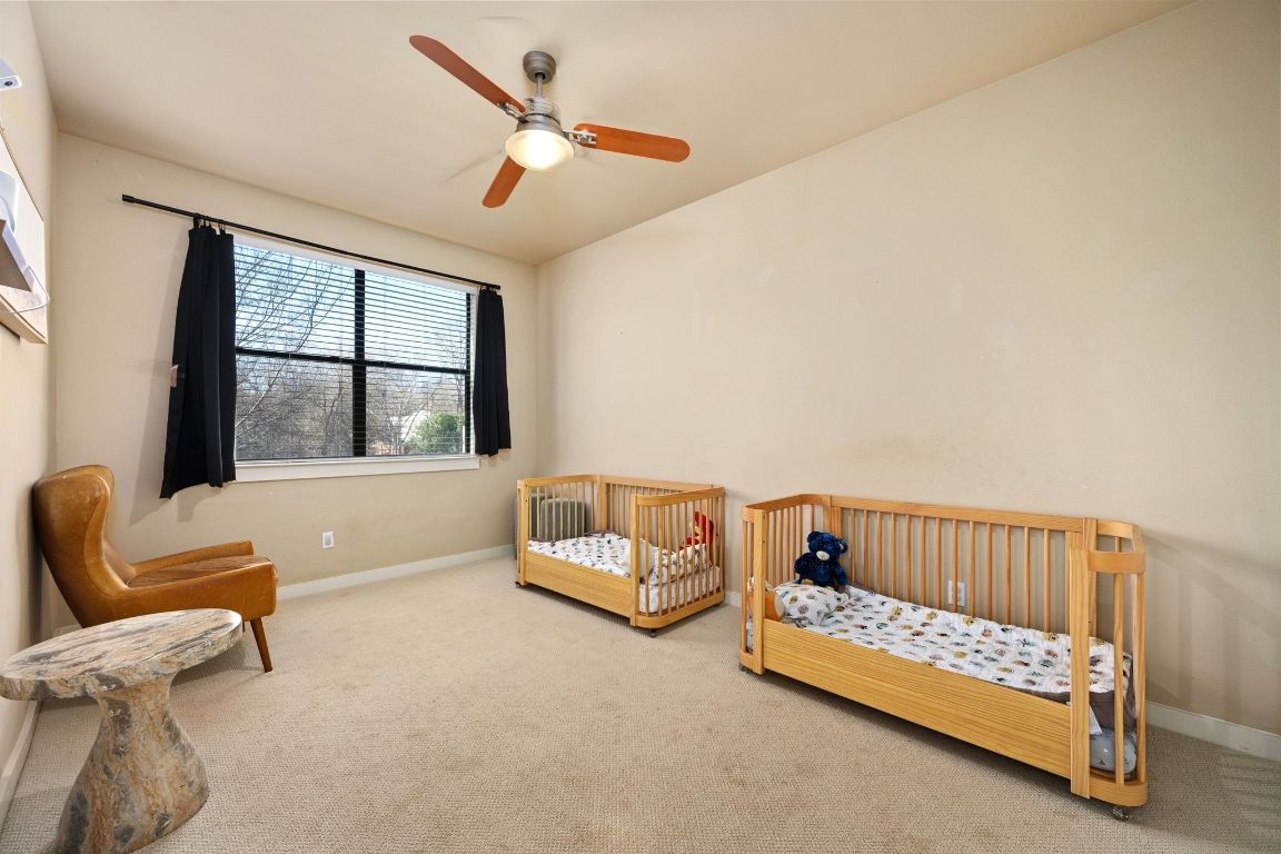 2819 Corbin Lane Austin, TX 78704 - Photo 16 of 22 a bedroom with furniture and a large window