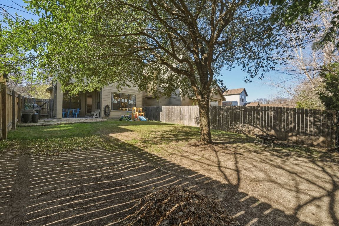 2819 Corbin Lane Austin, TX 78704 - Photo 20 of 22 a view of a yard with plants and trees