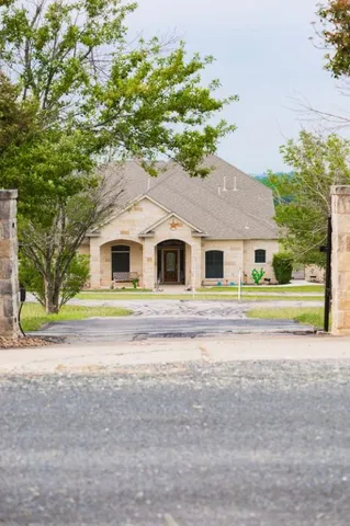 a house with a trees in the background