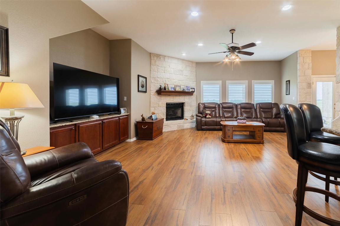 20145 Janak Road Coupland, TX 78615 - Photo 21 of 40 a living room with fireplace furniture and a flat screen tv