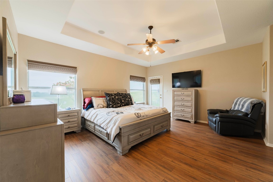 20145 Janak Road Coupland, TX 78615 - Photo 22 of 40 a living room with a bed furniture and a flat screen tv