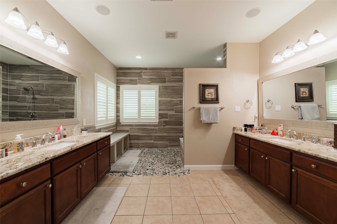 20145 Janak Road Coupland, TX 78615 - Photo 24 of 40 a kitchen with a sink and a stove top oven
