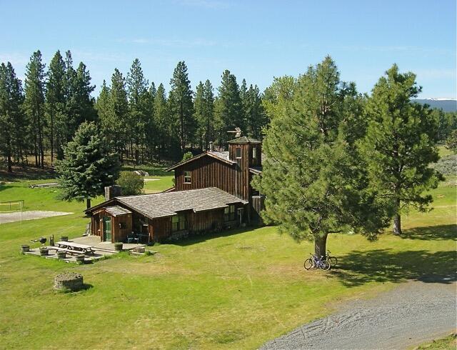 67500 Three Creek Road Sisters, OR 97759 - Photo 28 of 40 a view of a house with pool and a yard