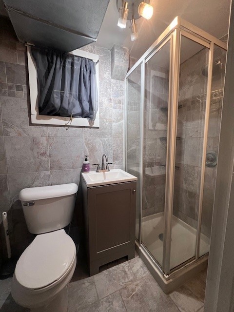 244 Indian Trail Lake In The Hills, IL 60156 - Photo 15 of 23 a bathroom with a toilet sink and shower