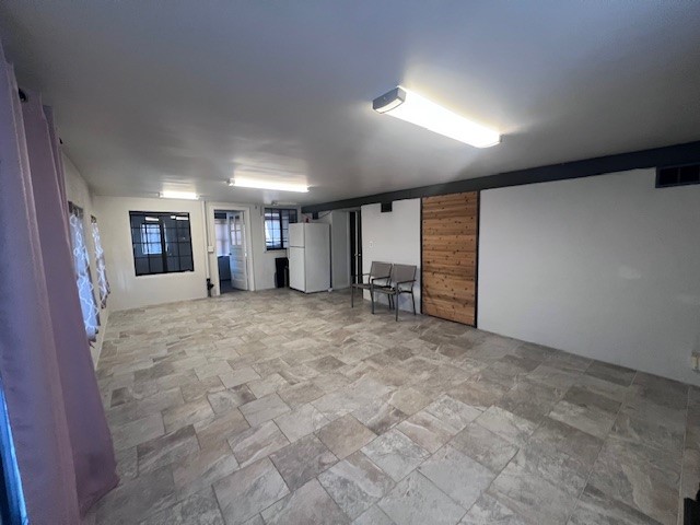 244 Indian Trail Lake In The Hills, IL 60156 - Photo 17 of 23 en empty room with furniture and window