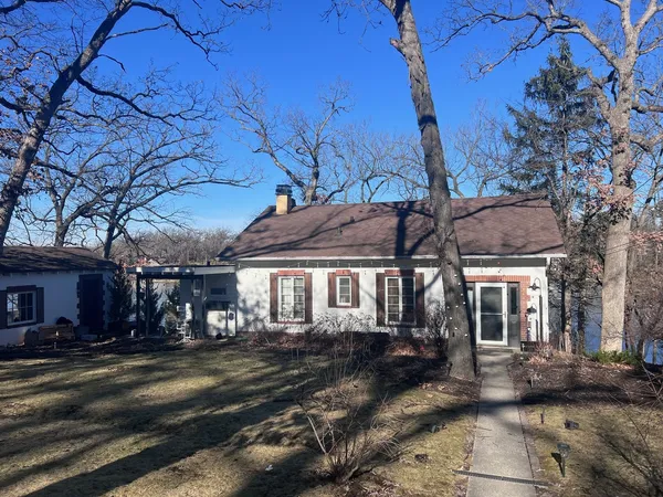 front view of a house with a tree