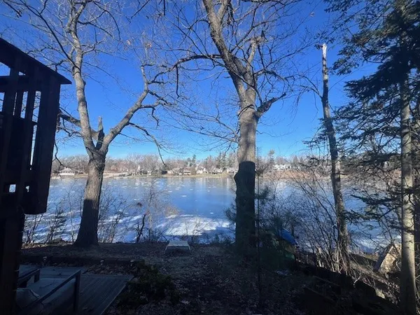 a view of a backyard of the house
