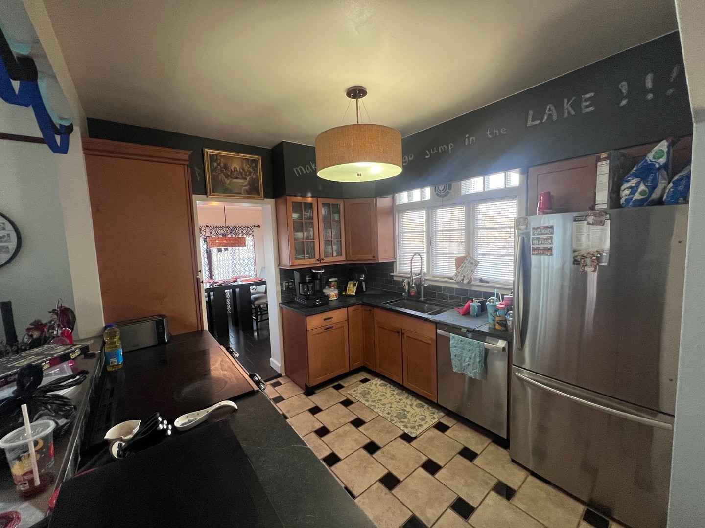 244 Indian Trail Lake In The Hills, IL 60156 - Photo 4 of 23 a kitchen with granite countertop a refrigerator and a sink