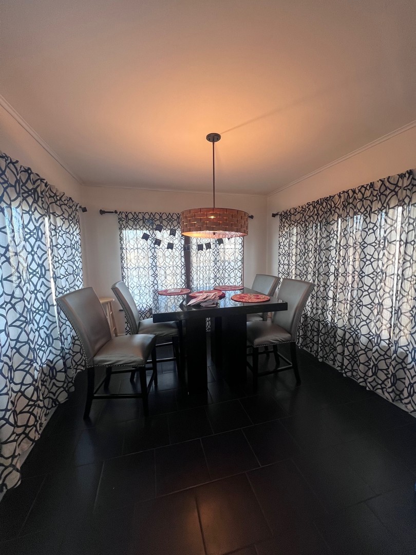 244 Indian Trail Lake In The Hills, IL 60156 - Photo 5 of 23 a view of a dining room with furniture and window