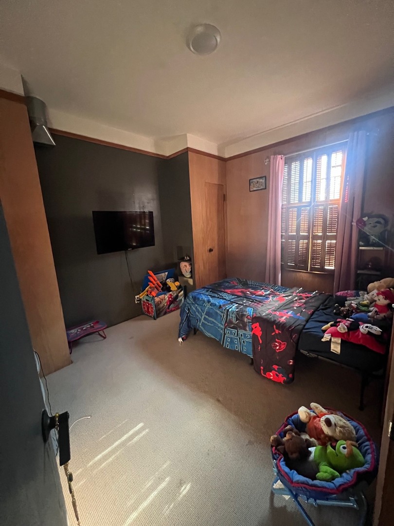 244 Indian Trail Lake In The Hills, IL 60156 - Photo 7 of 23 a bedroom with a bed and a flat screen tv