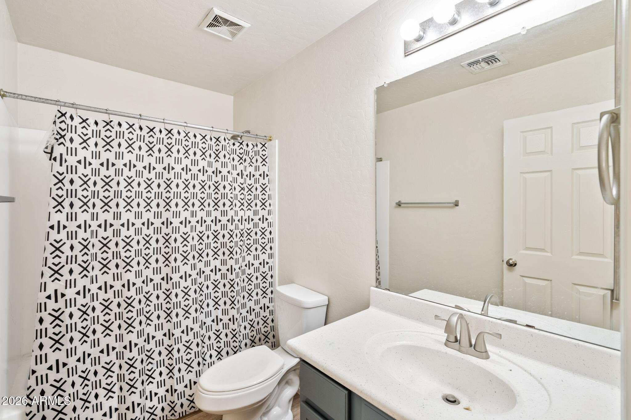 1332 East Dunbar Drive Phoenix, AZ 85042 - Photo 17 of 50 a bathroom with a sink toilet and shower
