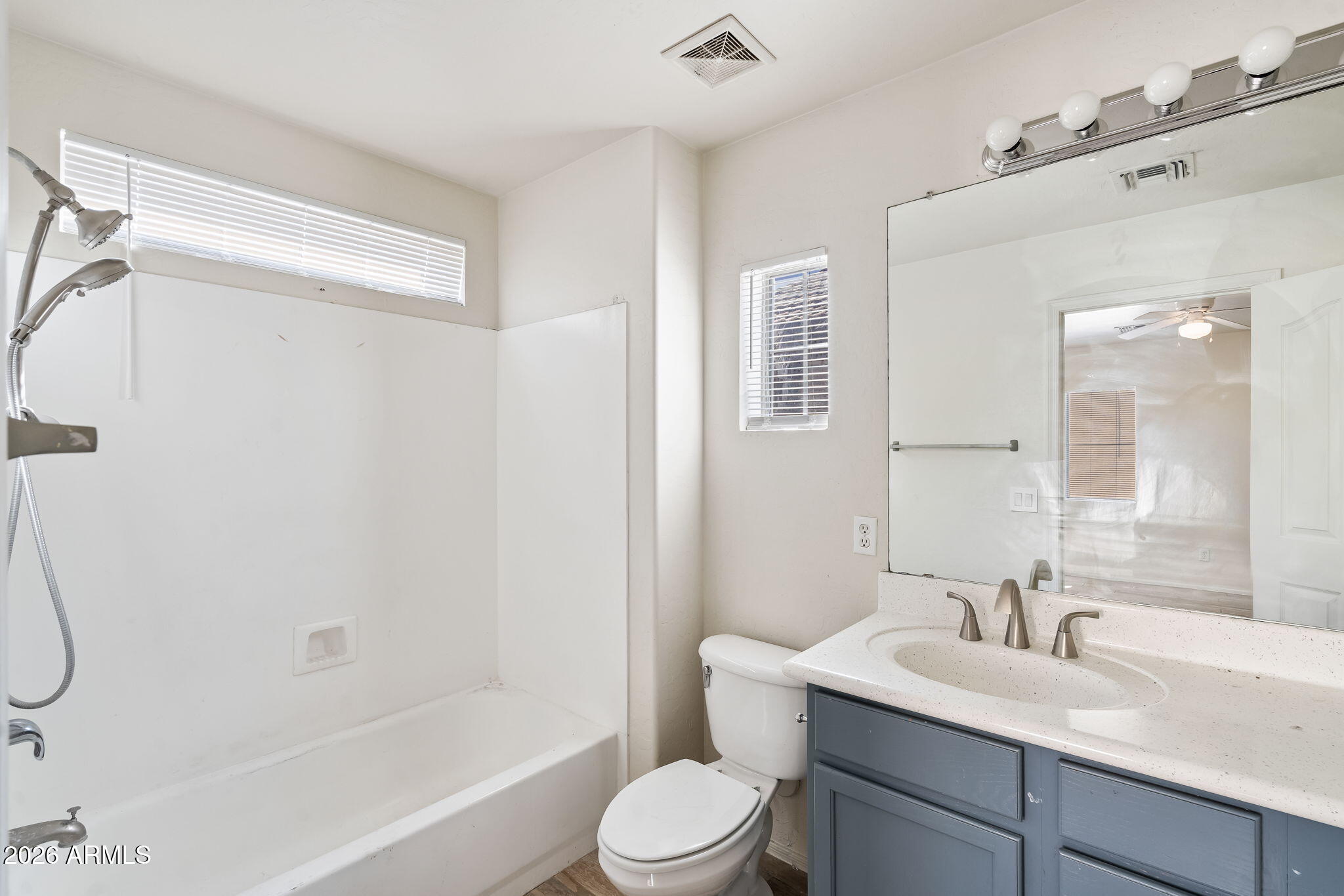 1332 East Dunbar Drive Phoenix, AZ 85042 - Photo 27 of 50 a bathroom with a sink toilet vanity and shower