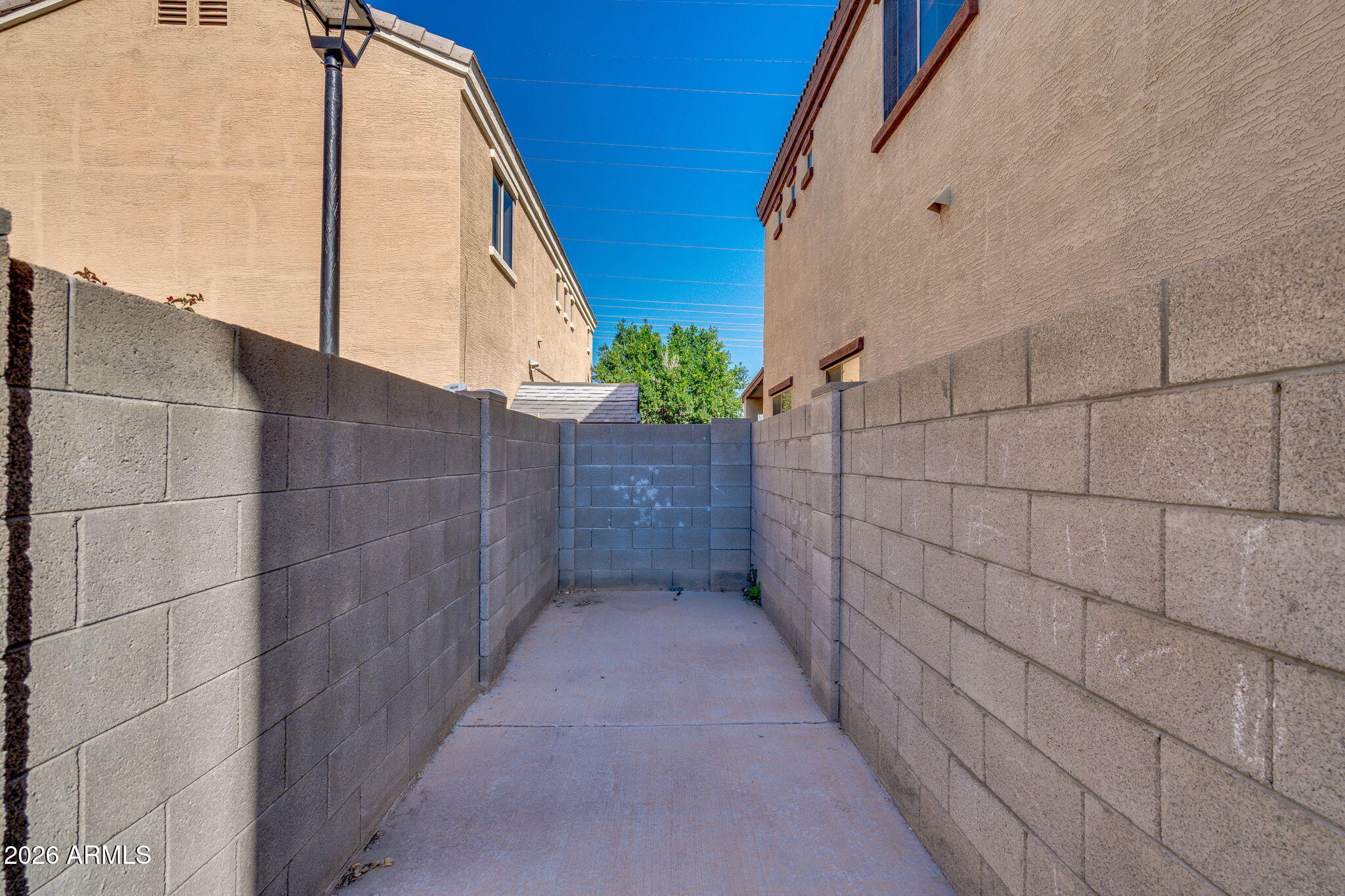 1332 East Dunbar Drive Phoenix, AZ 85042 - Photo 31 of 50 a view of a pathway along a building