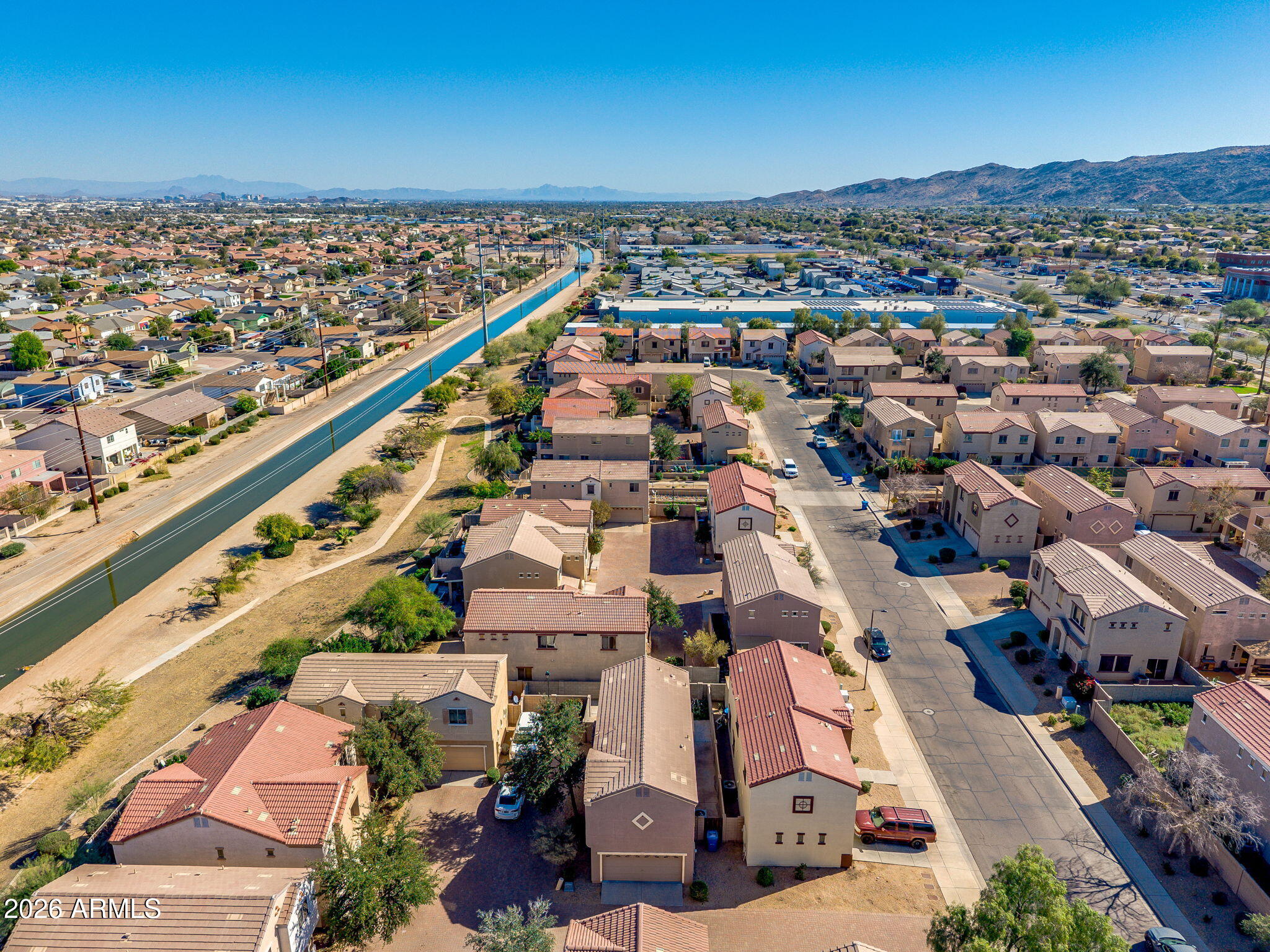 1332 East Dunbar Drive Phoenix, AZ 85042 - Photo 44 of 50 an aerial view of residential houses with outdoor space