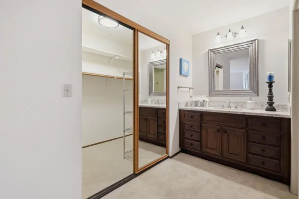 a white toilet sitting next to a bathroom shower