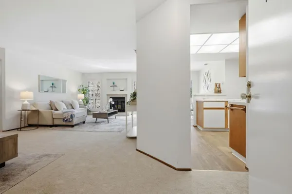 a living room with furniture and a mirror