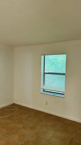 a view of a room that has a window