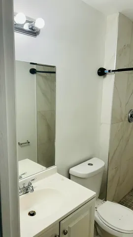 a view of a room with a door and a white door