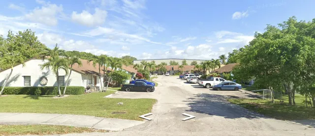 a view of yard with swimming pool and sitting area