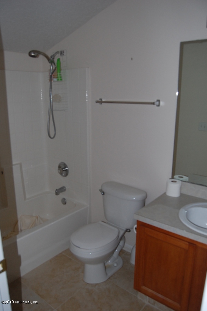 2444 Paris Mill Road Jacksonville, FL 32221 - Photo 15 of 19 a white toilet sitting next to a bath tub