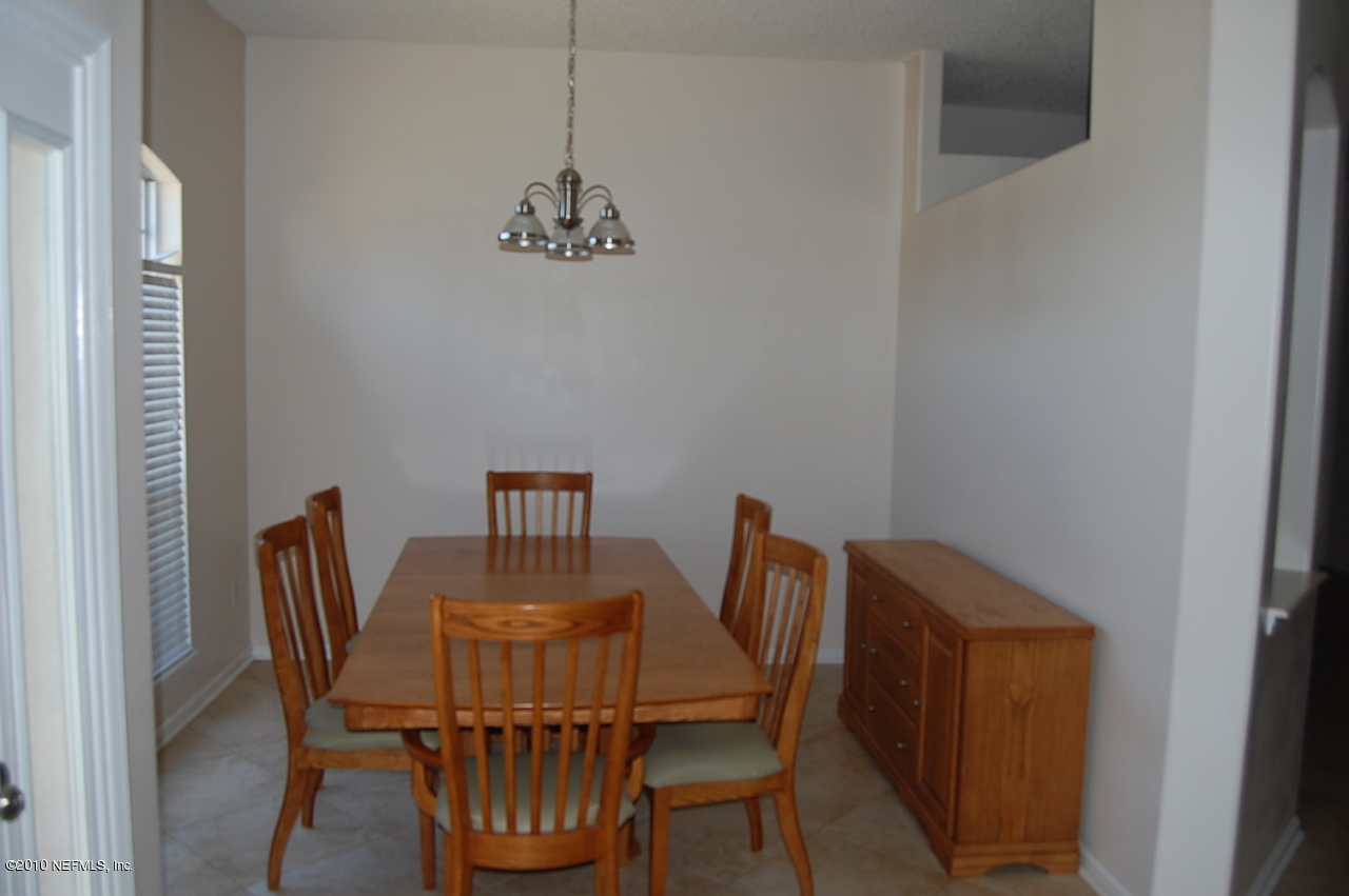 2444 Paris Mill Road Jacksonville, FL 32221 - Photo 3 of 19 a view of a dining room with furniture window and outside view