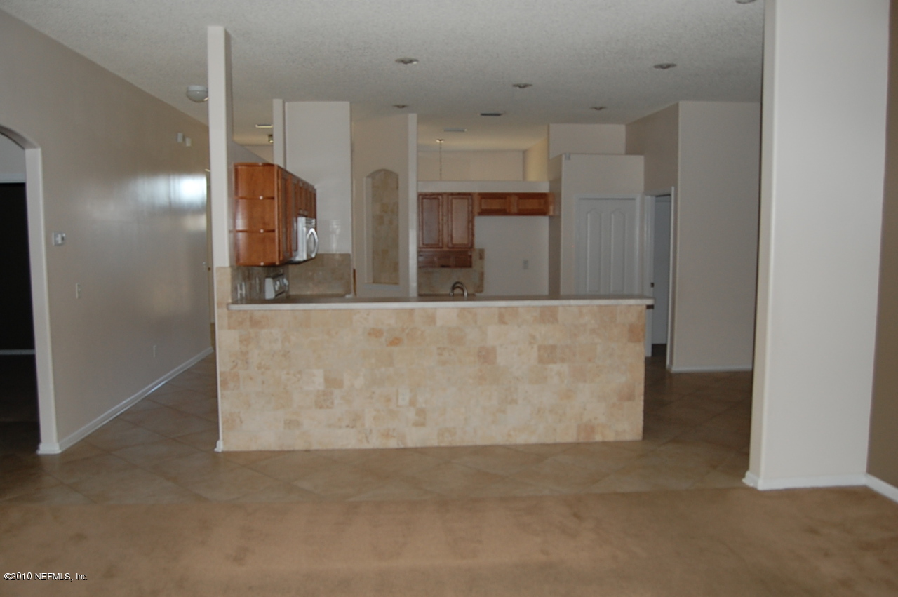 2444 Paris Mill Road Jacksonville, FL 32221 - Photo 8 of 19 a view of a kitchen cabinets and a refrigerator