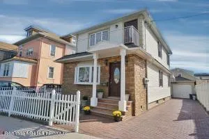 a front view of a house with a porch