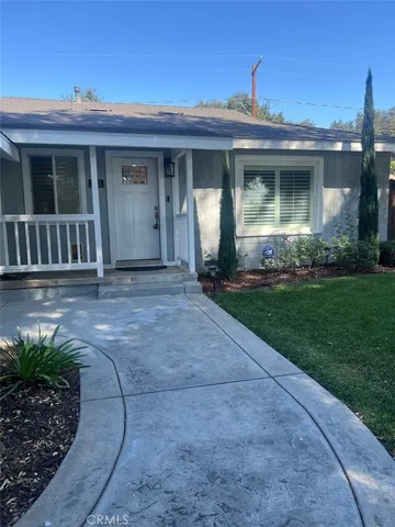 a view of house with front door and porch