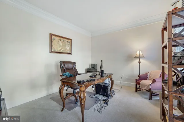a living room with furniture and a clock