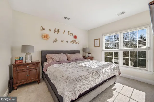 a en suite bathroom with a sink double vanity and a mirror