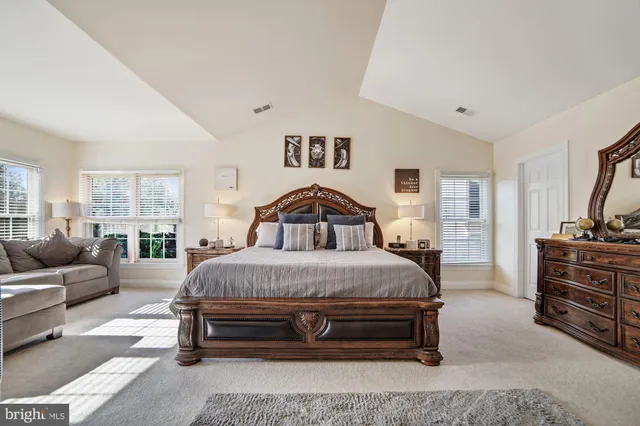 a spacious bathroom with a sink a mirror and a shower