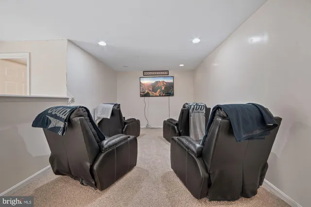 a living room with furniture and a lamp