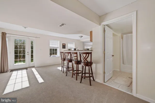 a living room with furniture and a table
