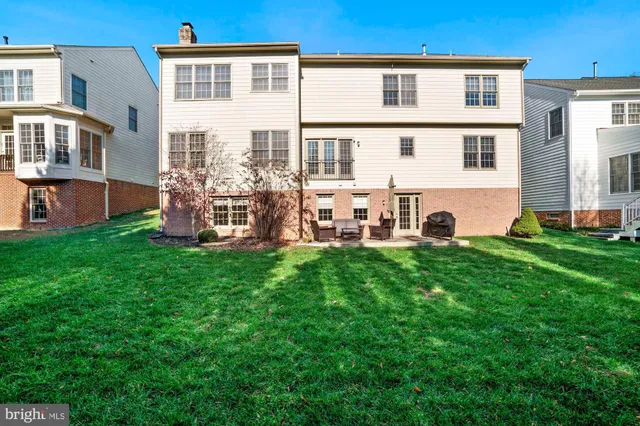 a view of a swimming pool with outdoor seating