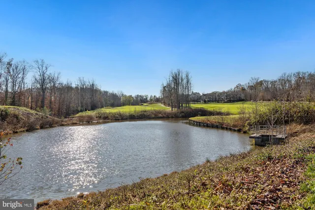 a view of a blue house with a yard