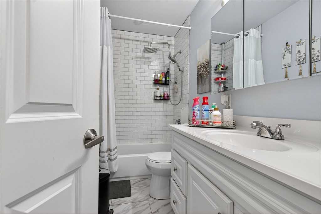 1684 North Shore Road Revere, MA 02151 - Photo 17 of 39 a bathroom with a sink a toilet and shower
