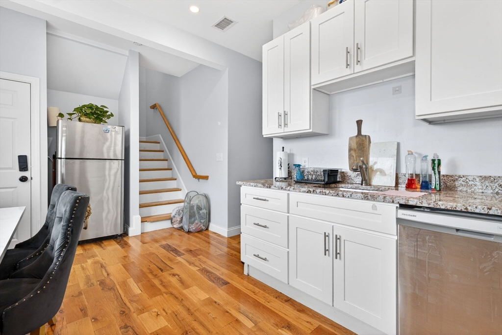 1684 North Shore Road Revere, MA 02151 - Photo 23 of 39 a kitchen with white cabinets and sink