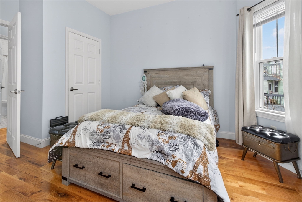 1684 North Shore Road Revere, MA 02151 - Photo 27 of 39 a bedroom with a bed and a window