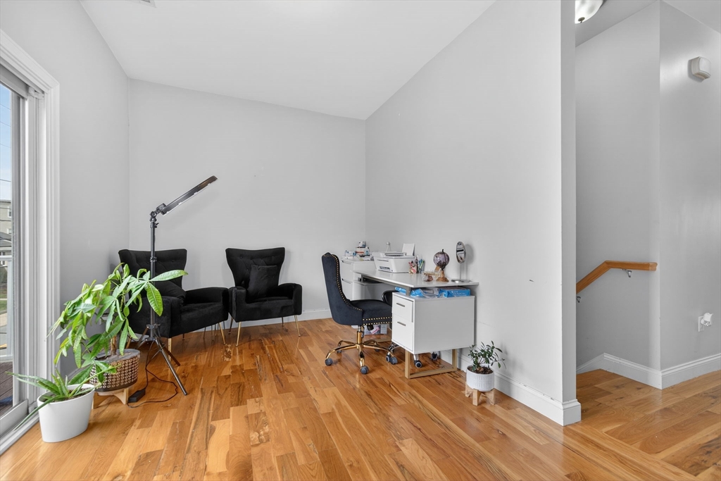 1684 North Shore Road Revere, MA 02151 - Photo 31 of 39 a living room with furniture and a potted plant