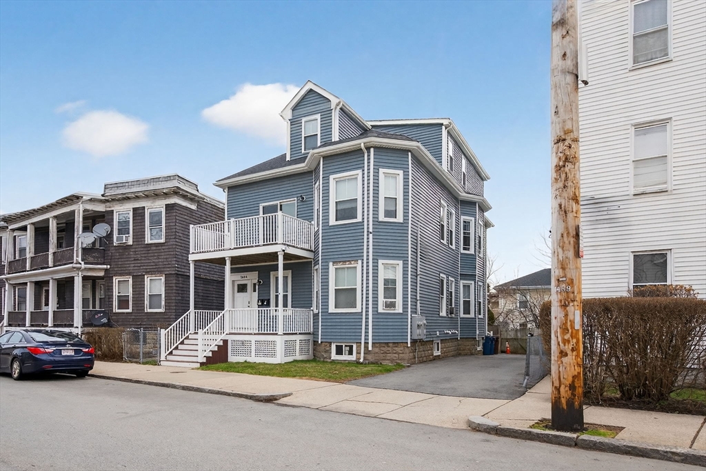 1684 North Shore Road Revere, MA 02151 - Photo 38 of 39 a front view of a building with lot of cars and trees