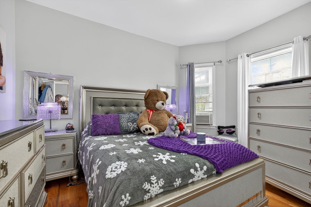 1684 North Shore Road Revere, MA 02151 - Photo 7 of 39 a bed room with a bed and a window
