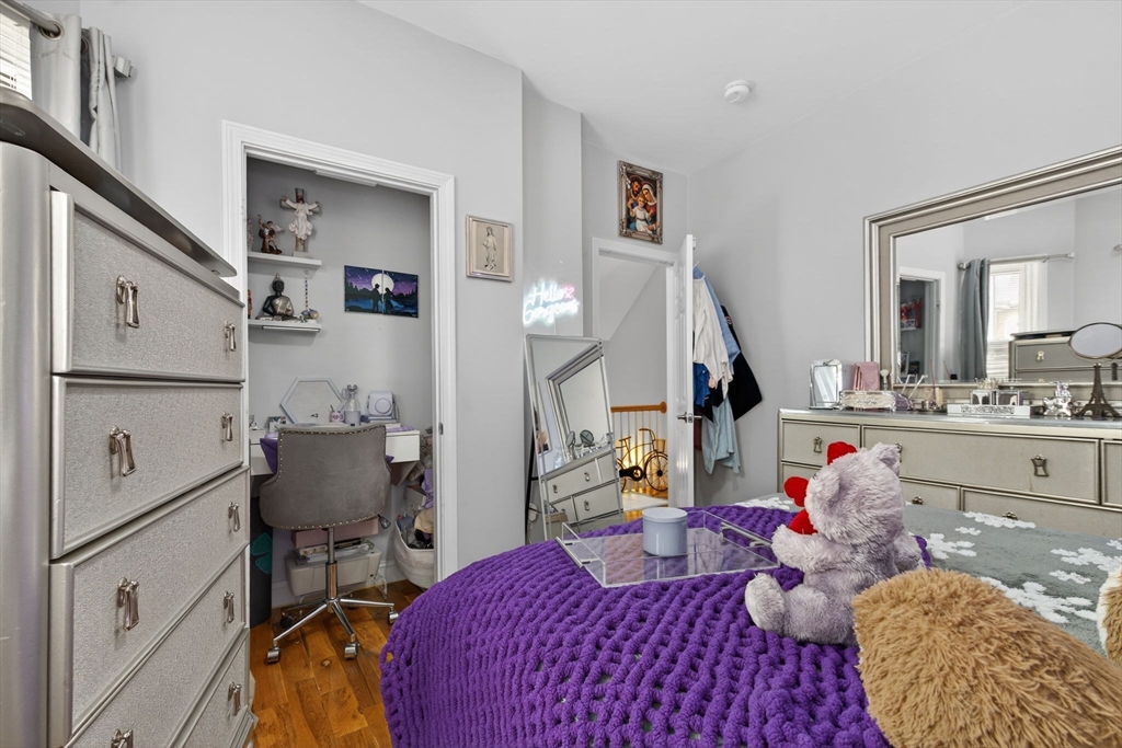1684 North Shore Road Revere, MA 02151 - Photo 8 of 39 a bedroom with furniture and a wooden floor