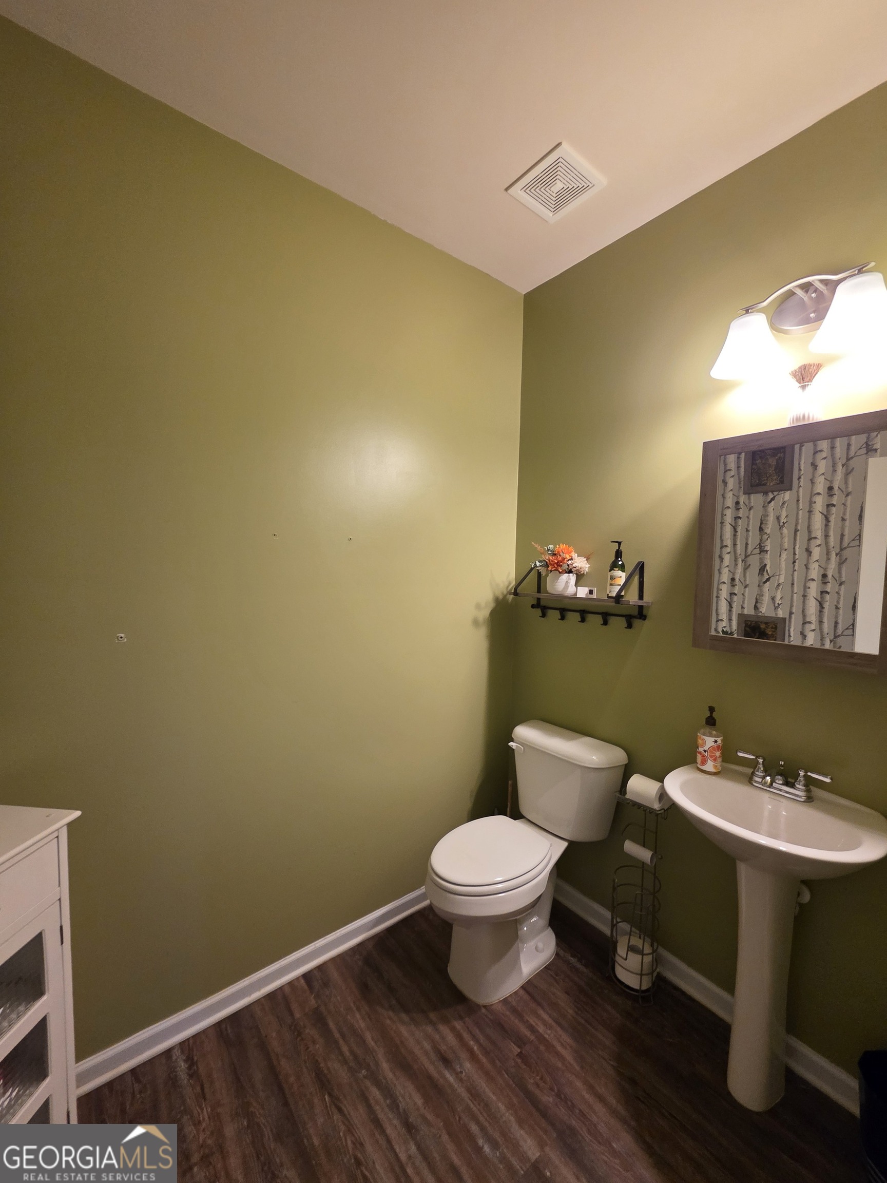 28 Thacker Trail Adairsville, GA 30103 - Photo 3 of 14 a bathroom with a sink mirror and toilet