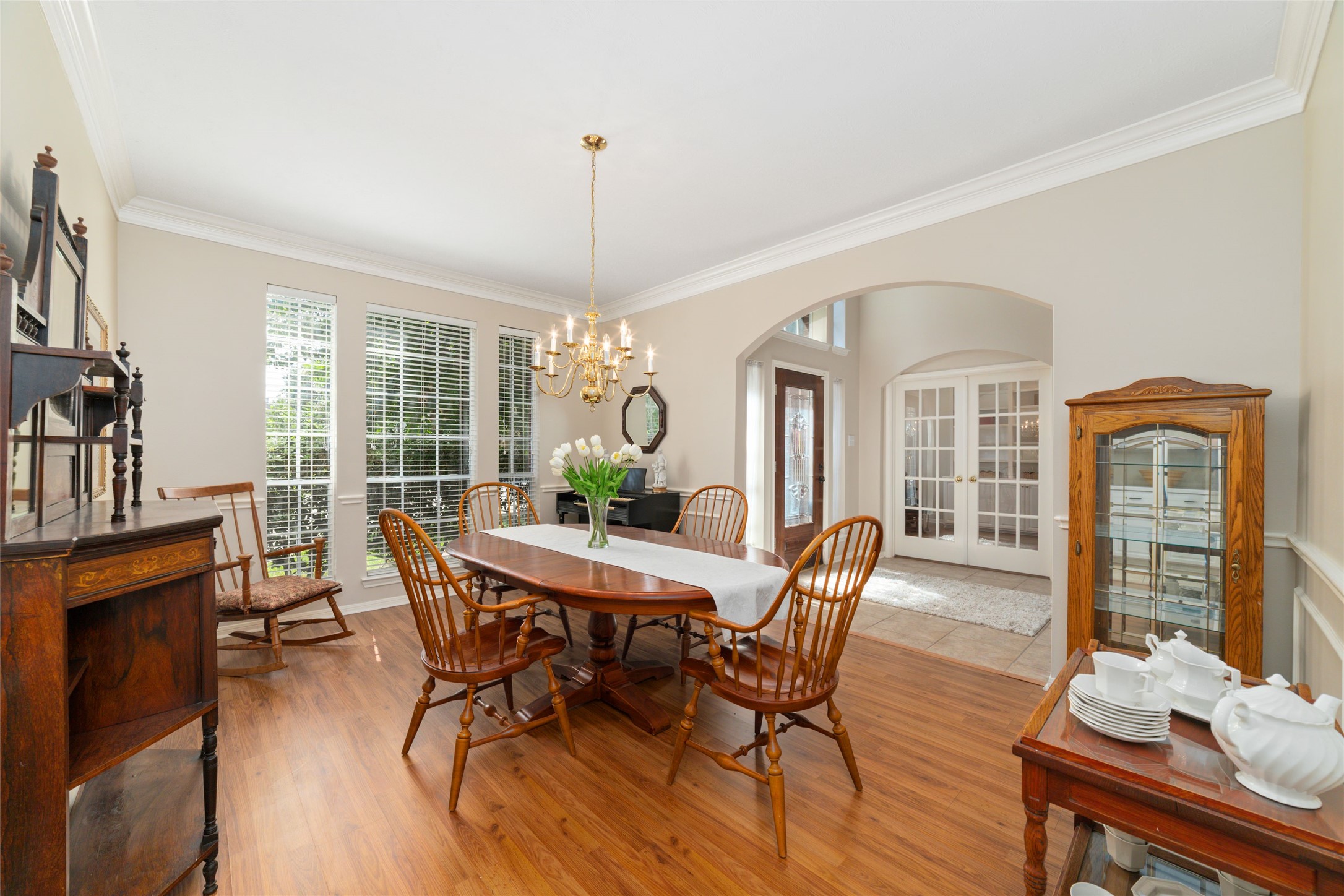 20423 Forest Drive Spring, TX 77388 - Photo 13 of 44 Elegant study area featuring sophisticated crown molding, chair rail and a decorative chandelier, with seamless access to the kitchen for effortless entertaining and service.
