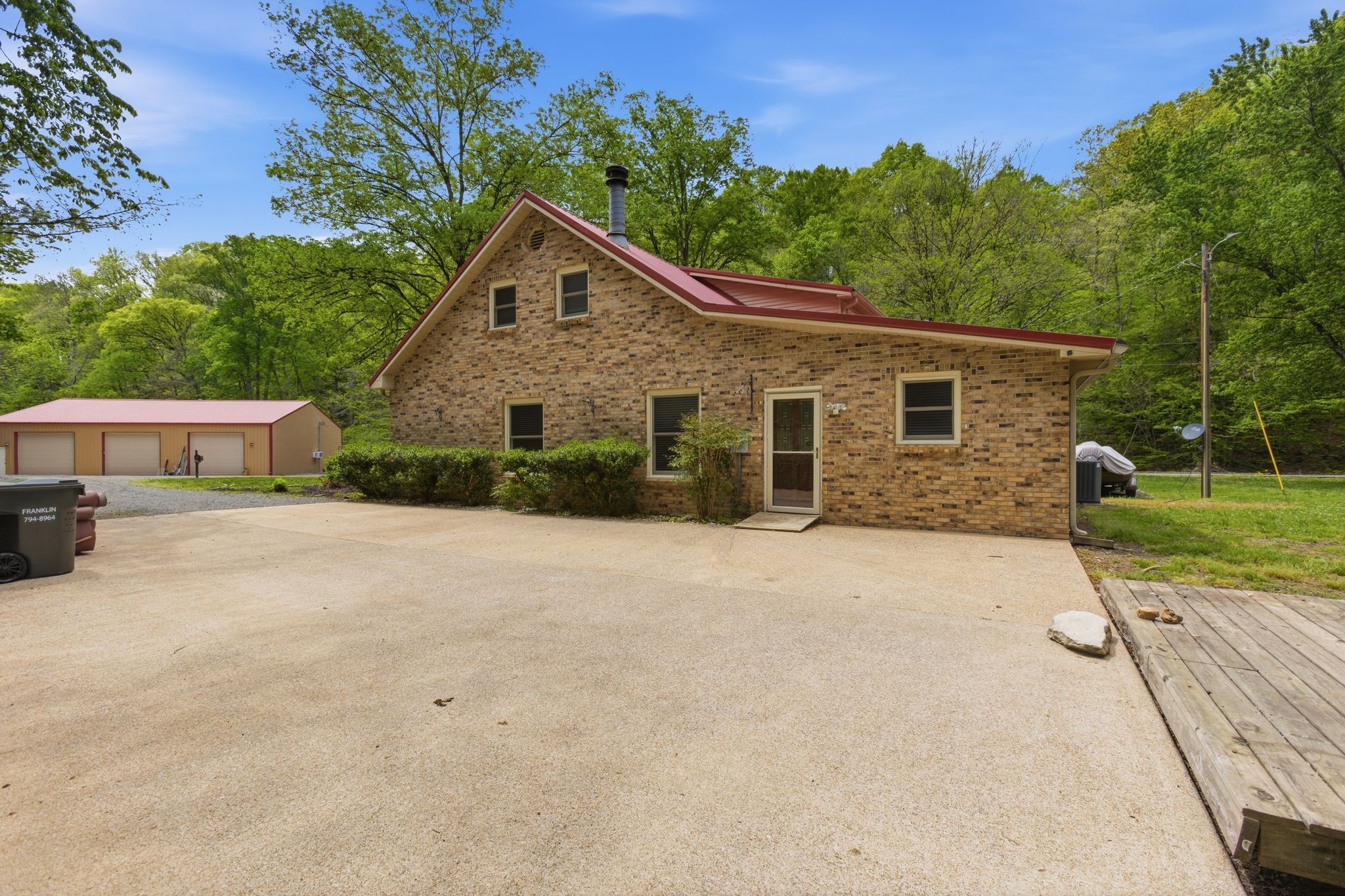 580 Defeated Creek Road Centerville, TN 37033 - Photo 59 of 71 a front view of a house with a yard and garage