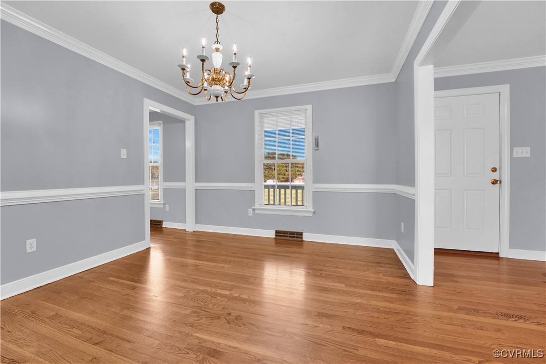 5285 Sandy Valley Road Mechanicsville, VA 23111 - Photo 12 of 37 a view of an empty room with wooden floor and a window