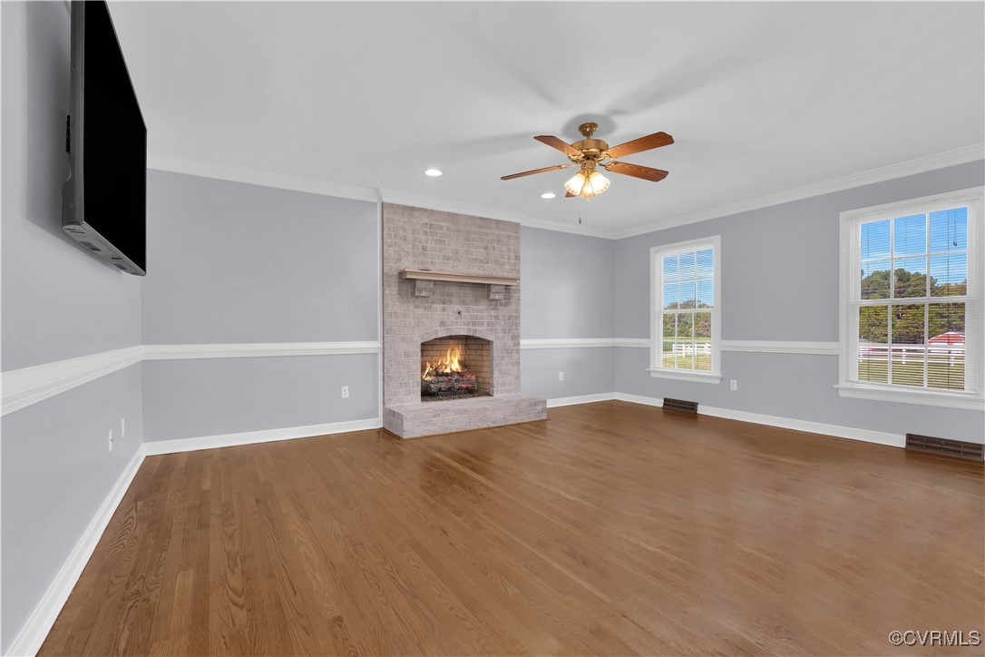 5285 Sandy Valley Road Mechanicsville, VA 23111 - Photo 16 of 37 an empty room with windows and fireplace