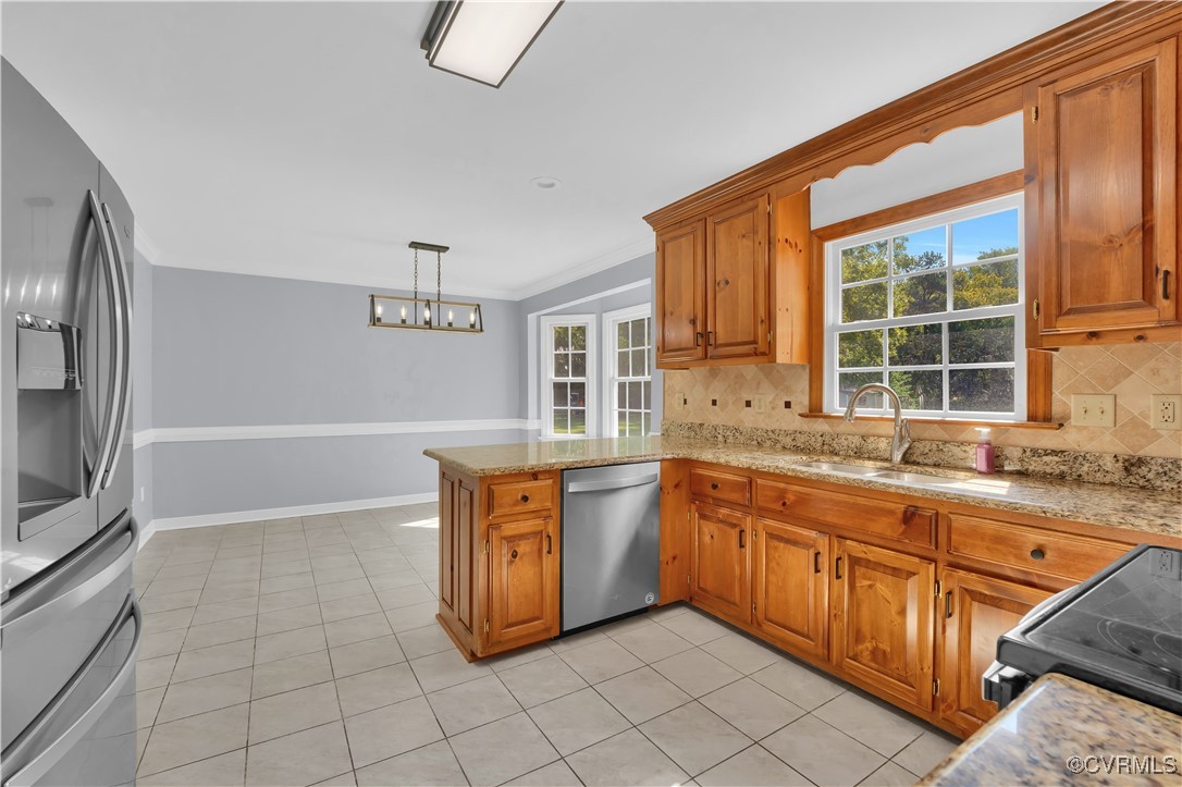 5285 Sandy Valley Road Mechanicsville, VA 23111 - Photo 18 of 37 a large kitchen with granite countertop a sink and a stove top oven